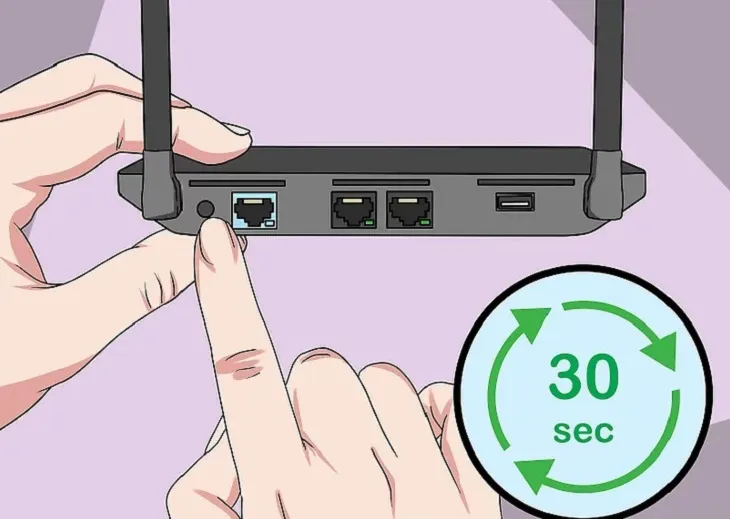 Nhấn và giữ nút Reset